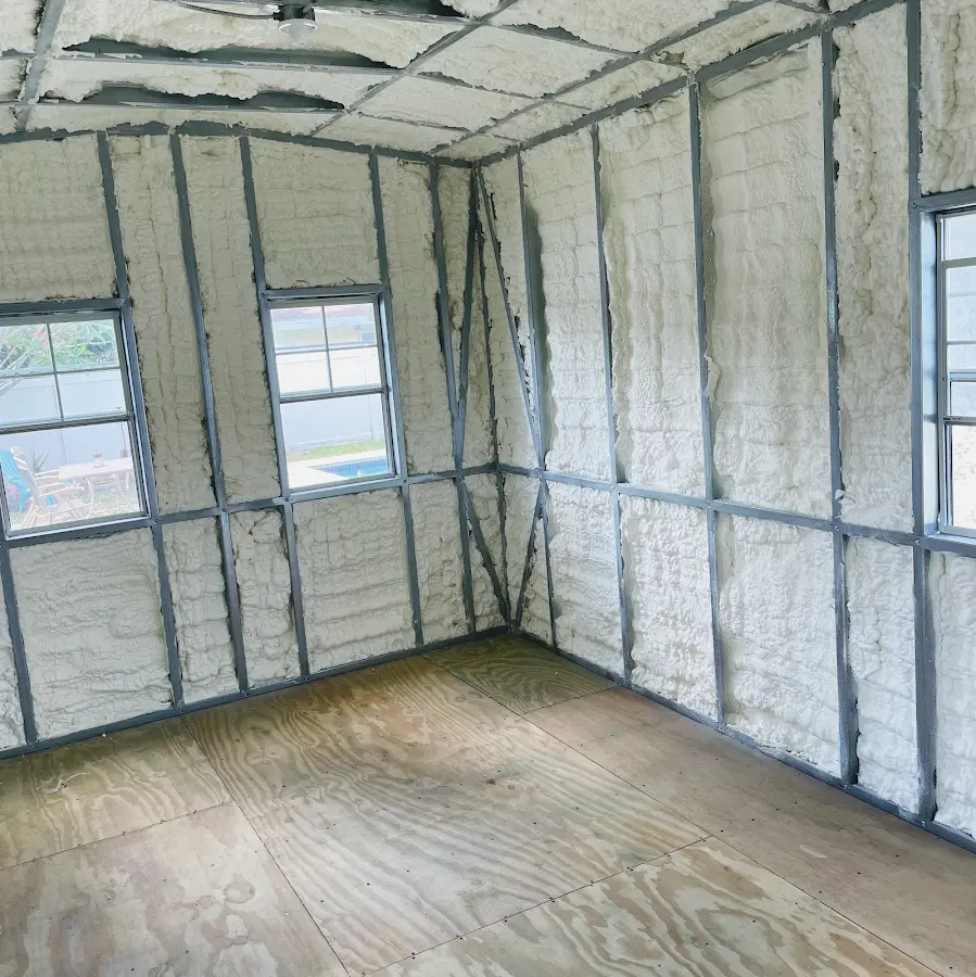 Closed-cell spray foam insulation applied to wall cavities in a residential project in Ledyard